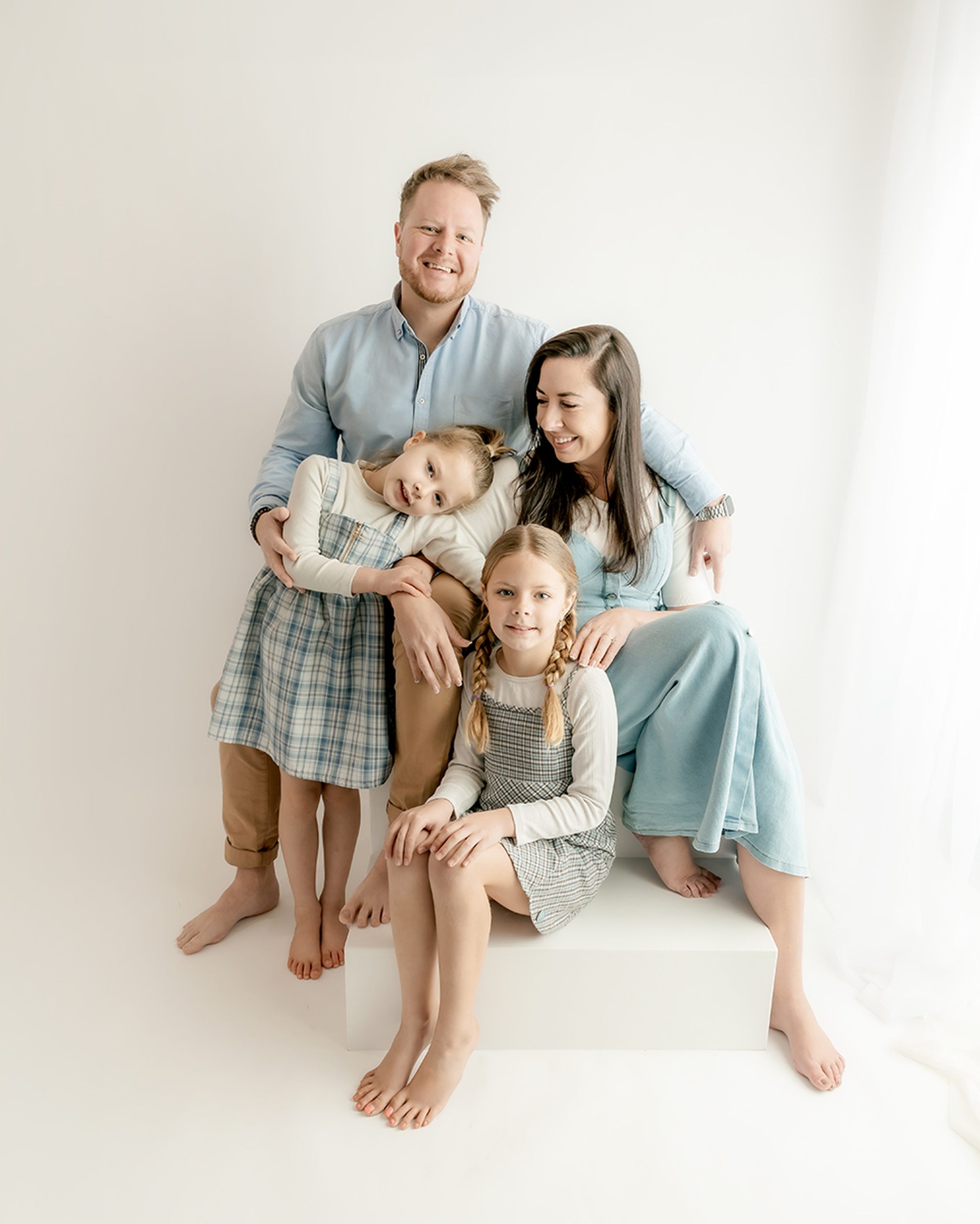 photo of a family of four, at mini studio